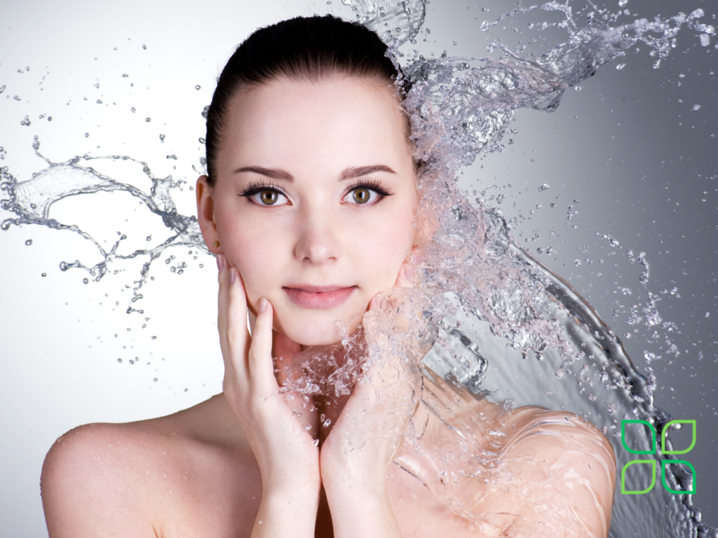 beautiful woman splashing hydrogen water on her face