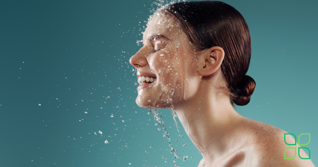 woman splashing through water with beautiful skin