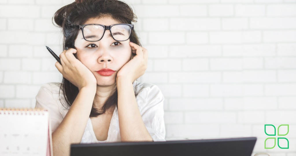 woman looking stressed and fatigued