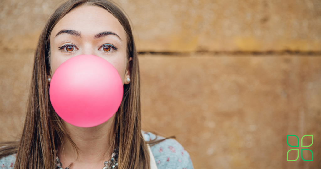 blowing bubble gum